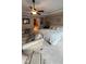 Relaxing main bedroom with a king-size bed, sitting area, and ceiling fan at 1175 Grassy Oat Ln, Lawrenceville, GA 30045