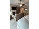 Main bedroom suite with a king-size bed, sitting area, and fireplace at 1175 Grassy Oat Ln, Lawrenceville, GA 30045