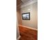 Upstairs hallway with hardwood floors and neutral wall color at 1175 Grassy Oat Ln, Lawrenceville, GA 30045