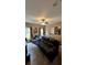 Entertainment room with sectional sofa and large screen TV at 1175 Grassy Oat Ln, Lawrenceville, GA 30045