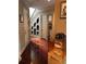 Spacious hallway with hardwood floors and built-in shelving at 1175 Grassy Oat Ln, Lawrenceville, GA 30045