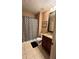 Clean bathroom with shower/tub combo and granite countertop at 1175 Grassy Oat Ln, Lawrenceville, GA 30045