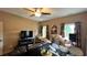 Finished recreation room with sectional sofa and drum set at 1175 Grassy Oat Ln, Lawrenceville, GA 30045