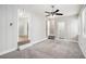 Sunroom with gray carpet, ceiling fan, and access to the bathroom and other rooms at 2623 Rex Sw Ave, Atlanta, GA 30331