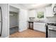 Kitchen with white cabinets, stainless steel appliances, and granite countertops at 2623 Rex Sw Ave, Atlanta, GA 30331