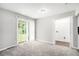 Gathering room with sliding glass doors to backyard and access to laundry room at 2623 Rex Sw Ave, Atlanta, GA 30331