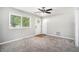 Bright living room features gray carpet, neutral walls, and a view of the front entrance at 2623 Rex Sw Ave, Atlanta, GA 30331