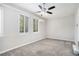 Spacious bedroom with gray carpet, neutral walls, and multiple windows at 2623 Rex Sw Ave, Atlanta, GA 30331