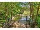 Serene pond with a fountain, surrounded by lush greenery and a relaxing deck at 956 Glenwood Park Se Dr, Atlanta, GA 30316