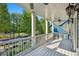 White-railed balcony with ceiling fan, offering a park view at 956 Glenwood Park Se Dr, Atlanta, GA 30316