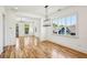 Open concept dining room with hardwood floors and kitchen view at 956 Glenwood Park Se Dr, Atlanta, GA 30316