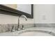 Close-up of a bathroom sink with marble countertop and chrome faucet at 956 Glenwood Park Se Dr, Atlanta, GA 30316