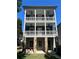 Three-story home with stone base and wrap-around porch at 956 Glenwood Park Se Dr, Atlanta, GA 30316