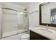 Clean bathroom with dark vanity and white subway tile shower at 956 Glenwood Park Se Dr, Atlanta, GA 30316