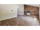 Bright living room featuring a brick fireplace and hardwood floors at 3215 Highway 20 Se, Conyers, GA 30013