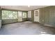 Large screened porch with concrete flooring and ample natural light at 3215 Highway 20 Se, Conyers, GA 30013