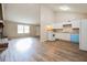 Kitchen with white cabinets, light countertops, and a blue dishwasher at 3215 Highway 20 Se, Conyers, GA 30013
