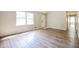 Living room with hardwood floors and neutral color palette at 3215 Highway 20 Se, Conyers, GA 30013