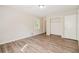Bright bedroom with hardwood floors and a large closet at 3215 Highway 20 Se, Conyers, GA 30013