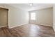Bright bedroom featuring wood-look floors and a window at 3215 Highway 20 Se, Conyers, GA 30013