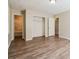 Spacious bedroom with wood-look floors and ample closet space at 3215 Highway 20 Se, Conyers, GA 30013