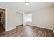 Well-lit bedroom, wood-look floors, and a closet at 3215 Highway 20 Se, Conyers, GA 30013