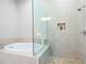 Bathroom with a walk-in shower and a soaking tub at 360 Chambers St # 151, Woodstock, GA 30188