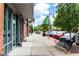 Street-level view of a vibrant streetscape with shops and a park-like setting at 360 Chambers St # 151, Woodstock, GA 30188