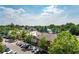 Aerial perspective of a vibrant town center with shops and parking at 360 Chambers St # 151, Woodstock, GA 30188