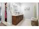 Elegant bathroom with dual vanities, a large mirror, and an enclosed shower at 360 Chambers St # 151, Woodstock, GA 30188