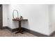 Building hallway with small table and mirror at 360 Chambers St # 151, Woodstock, GA 30188
