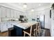 Island kitchen with granite countertops and stainless steel appliances at 360 Chambers St # 151, Woodstock, GA 30188