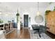 Modern dining area with black table, metal chairs, and statement wall decor at 360 Chambers St # 151, Woodstock, GA 30188