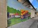 A charming mural depicting local scenes on a building exterior at 360 Chambers St # 151, Woodstock, GA 30188