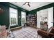 Bright home office with a view of living room and balcony at 360 Chambers St # 151, Woodstock, GA 30188