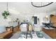 Open living area with hardwood floors, leather sectional sofa, and large windows at 360 Chambers St # 151, Woodstock, GA 30188