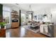 Large living room with hardwood floors, leather sofa, and built-in shelving at 360 Chambers St # 151, Woodstock, GA 30188