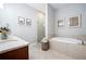 Primary bathroom with granite countertop, bathtub, and shower at 360 Chambers St # 151, Woodstock, GA 30188