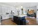 Spacious kitchen featuring granite countertops, stainless steel appliances, and white cabinetry at 360 Chambers St # 151, Woodstock, GA 30188