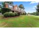 Two story brick home with large yard and manicured lawn at 1500 Terminal Ct, Mcdonough, GA 30252