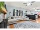 Open living space with L-shaped sofa, fireplace, and kitchen view at 1500 Terminal Ct, Mcdonough, GA 30252