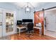 Home office with built-in desk and barn door at 1500 Terminal Ct, Mcdonough, GA 30252