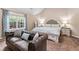 Main bedroom with a king-size bed and seating area at 1500 Terminal Ct, Mcdonough, GA 30252