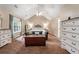 Main bedroom with trey ceiling, large bed, and ample dresser space at 1500 Terminal Ct, Mcdonough, GA 30252