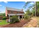 Brick home with covered patio, landscaping, and stone pathway at 1500 Terminal Ct, Mcdonough, GA 30252