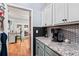 Butlers pantry with granite countertops and coffee bar at 1500 Terminal Ct, Mcdonough, GA 30252
