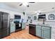 Modern kitchen with stainless steel appliances and light green cabinets at 1500 Terminal Ct, Mcdonough, GA 30252