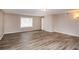 Large living room with hardwood floors and bay window at 3814 N Camp Creek Sw Pkwy, Atlanta, GA 30331