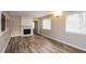 Bright living room featuring a fireplace and hardwood floors at 3814 N Camp Creek Sw Pkwy, Atlanta, GA 30331