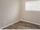 Bright bedroom featuring neutral walls and wood-look flooring at 3814 N Camp Creek Sw Pkwy, Atlanta, GA 30331